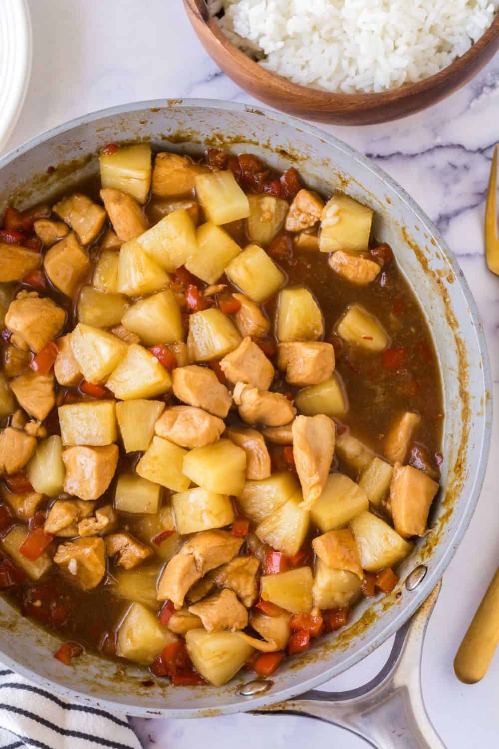 Making Hawaiian chicken in a pan.