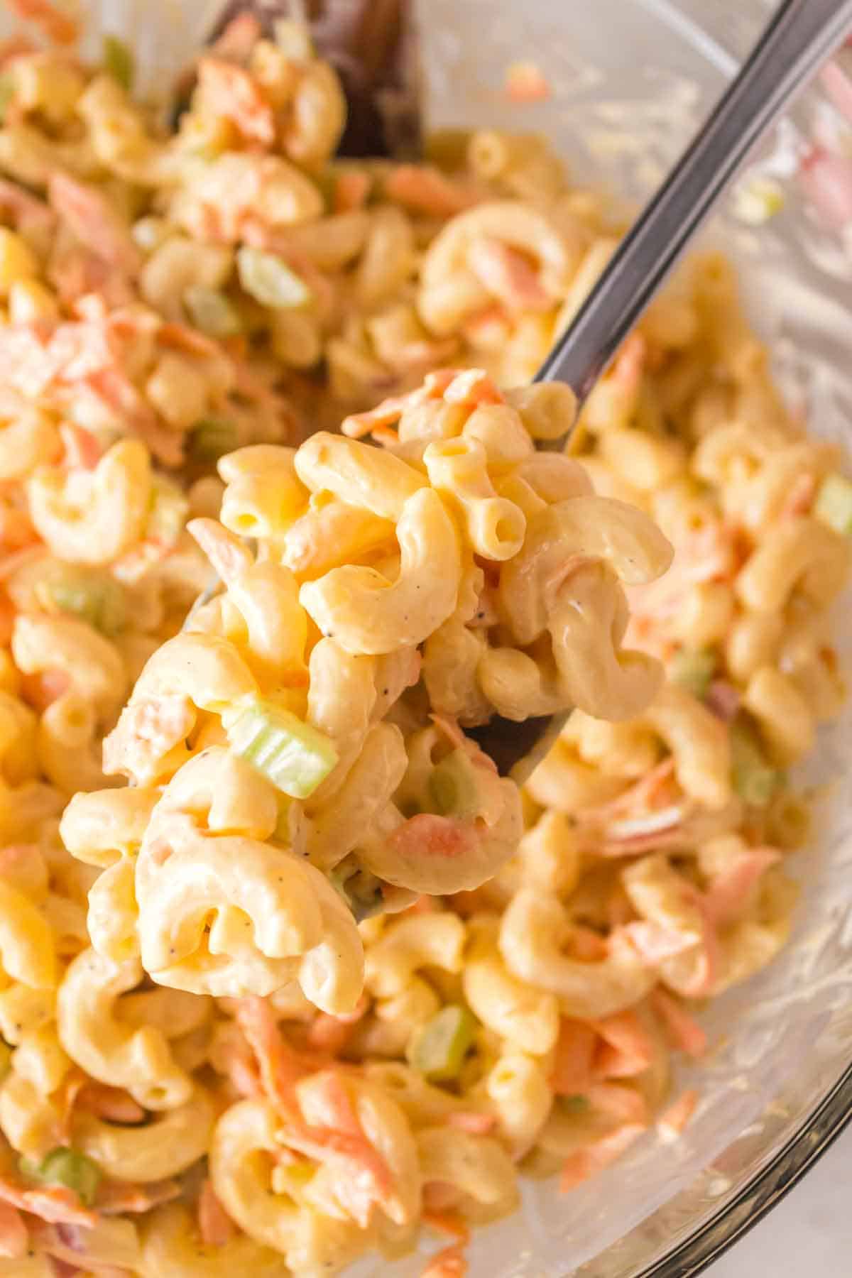 close up of Hawaiian Macaroni Salad in a clear mixing bowl