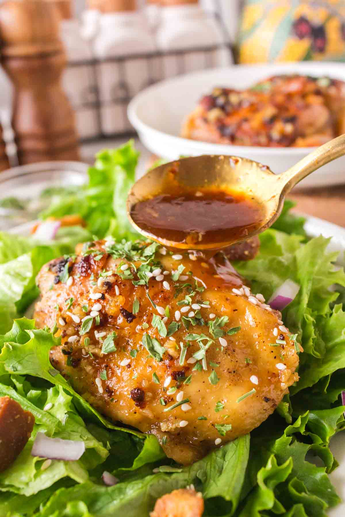 honey garlic chicken thighs over lettuce