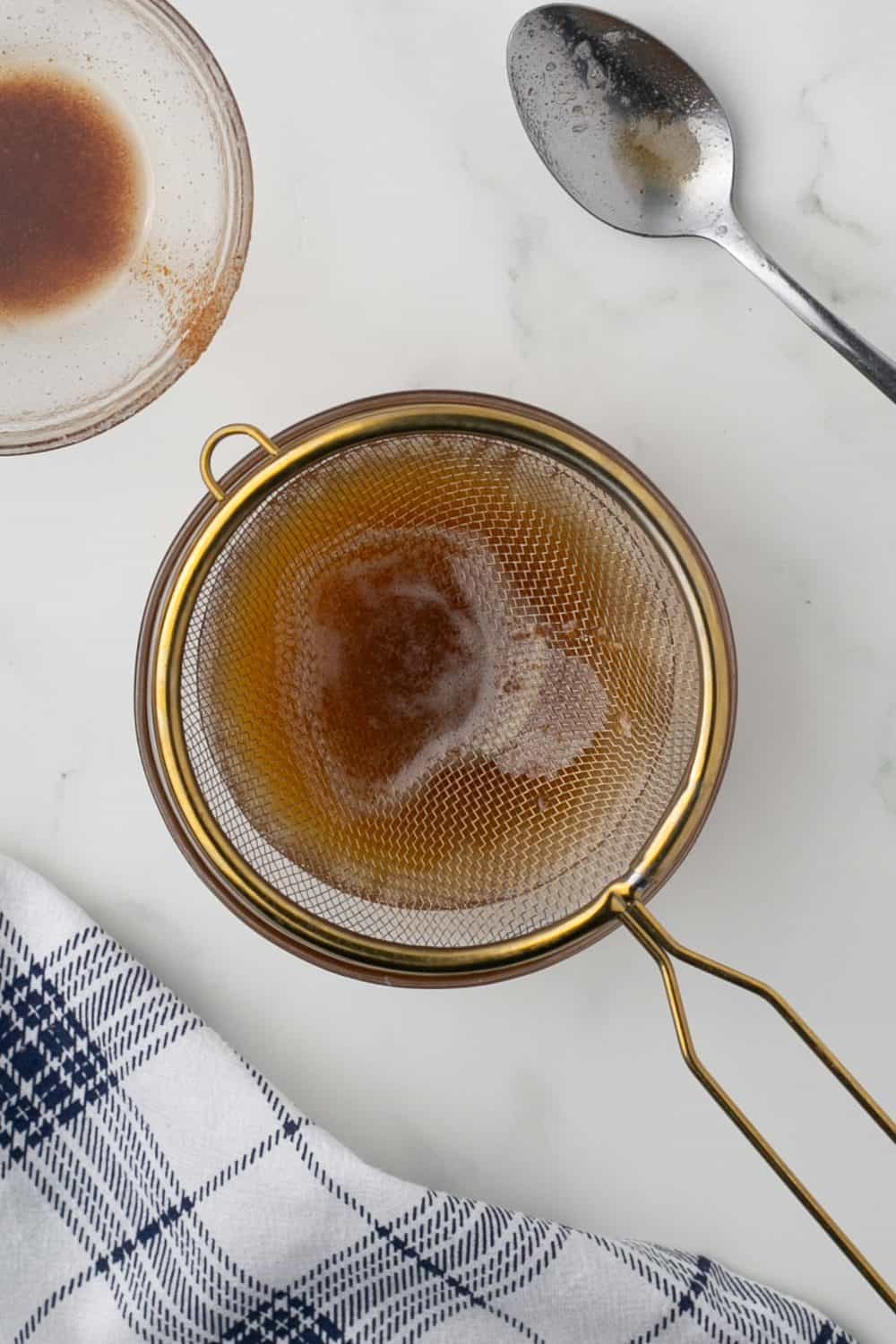 Straining step of browning butter.