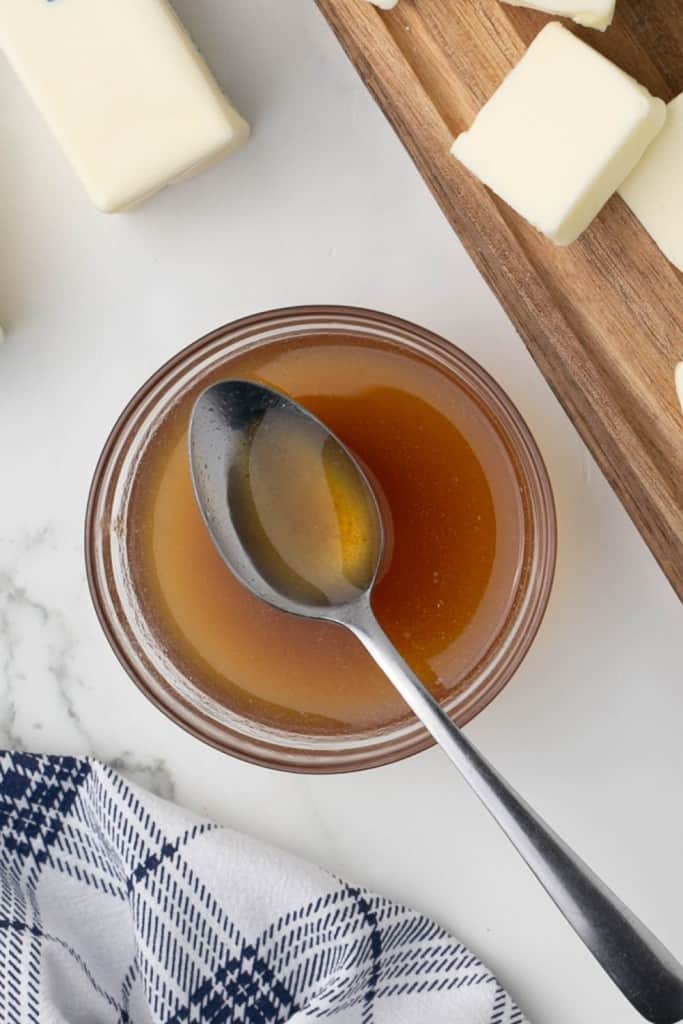 Browned butter in a dish with a spoon. 