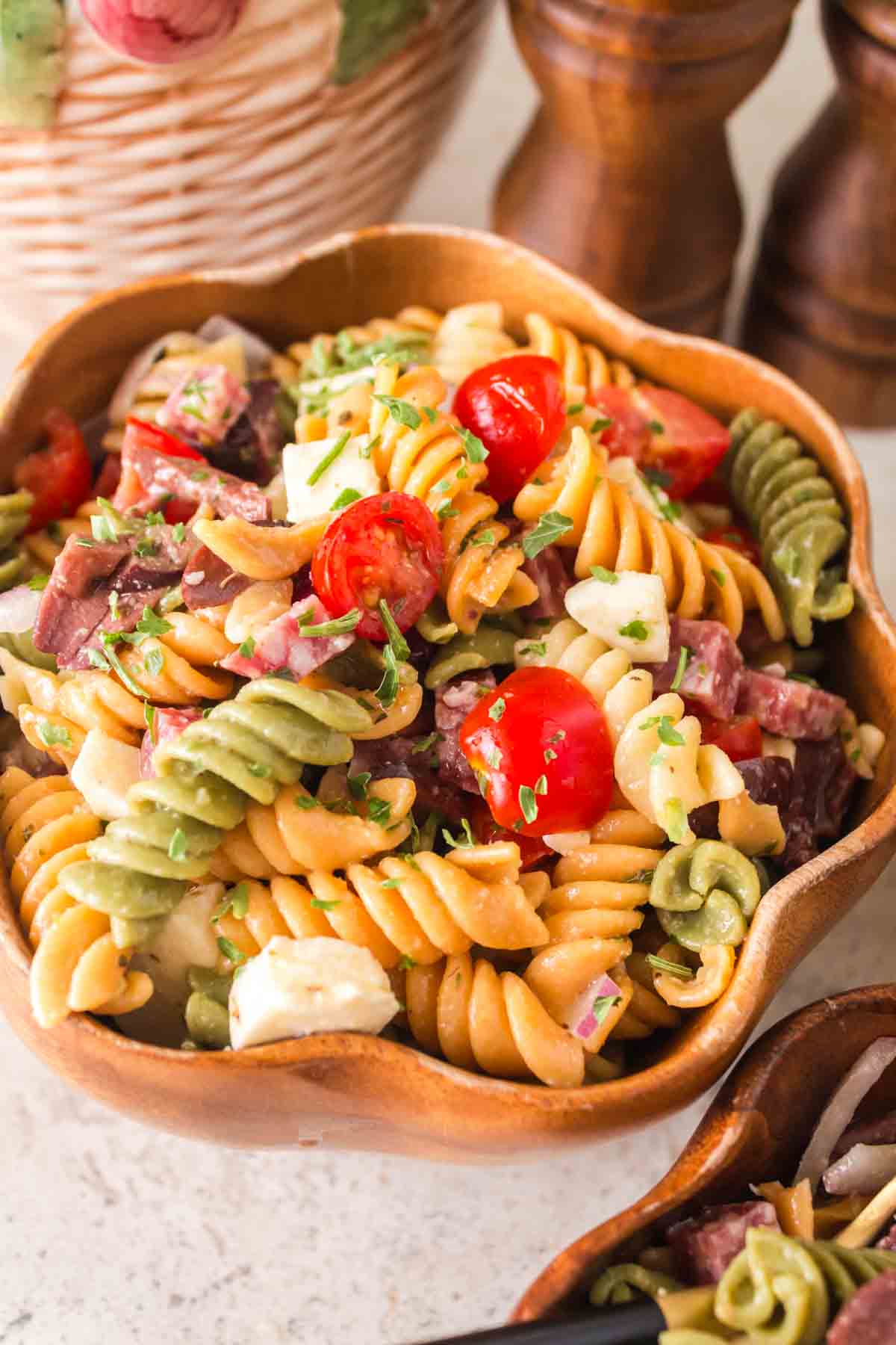Italian pasta salad in a wooden bowl