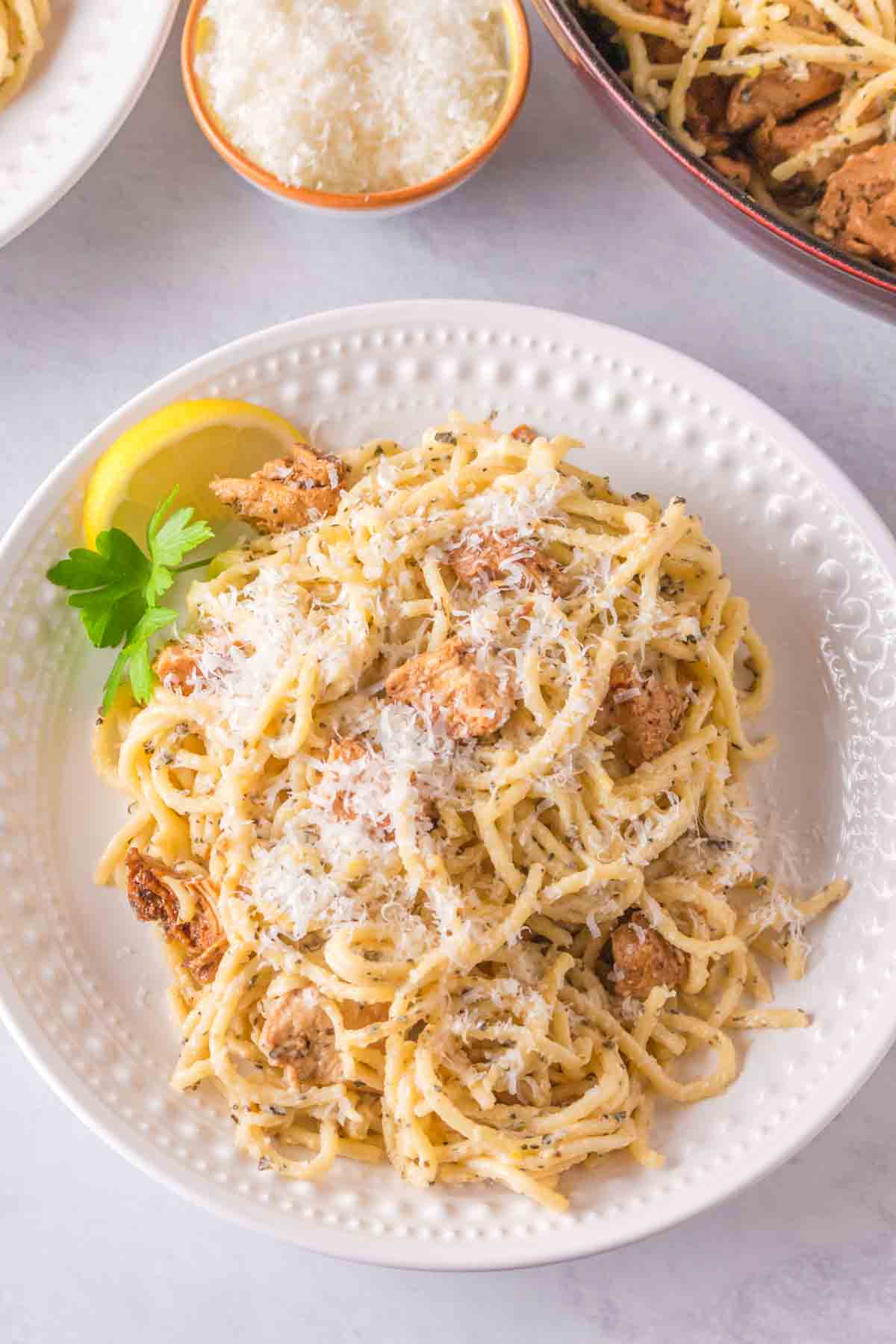 top view of lemon chicken pasta recipe served in a white bowl