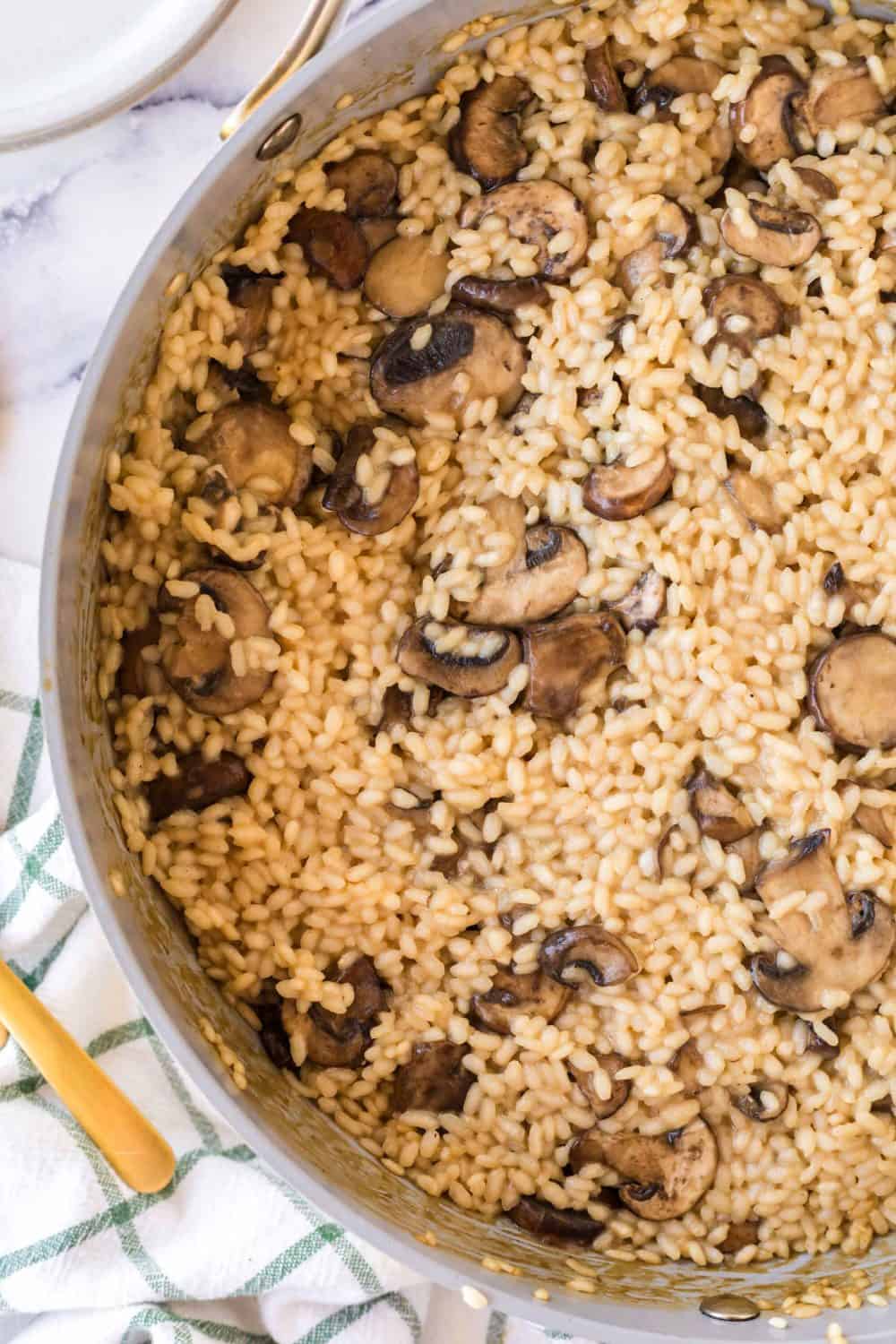 Pot of mushroom risotto cooking.