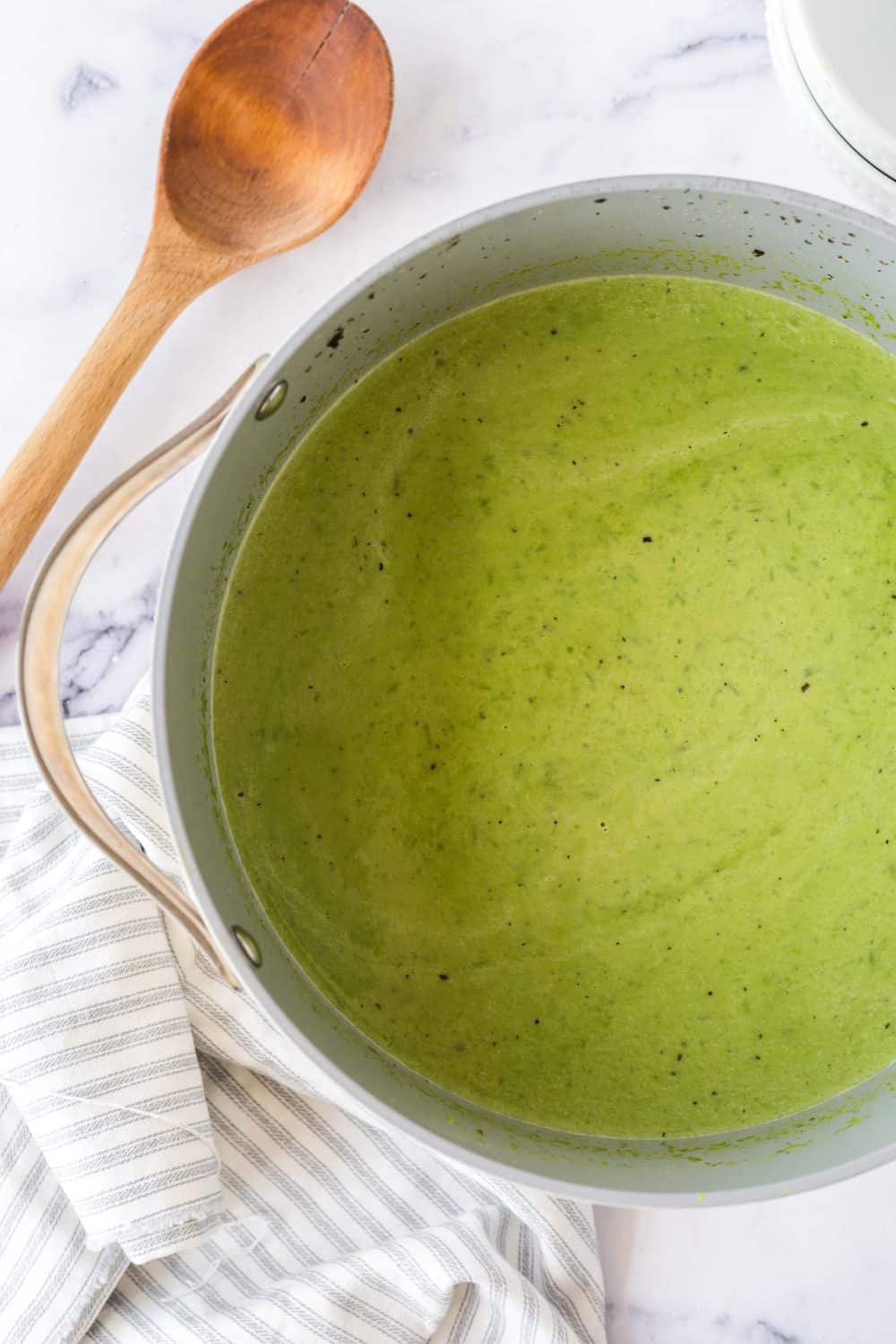 vibrant green pea soup in a pot