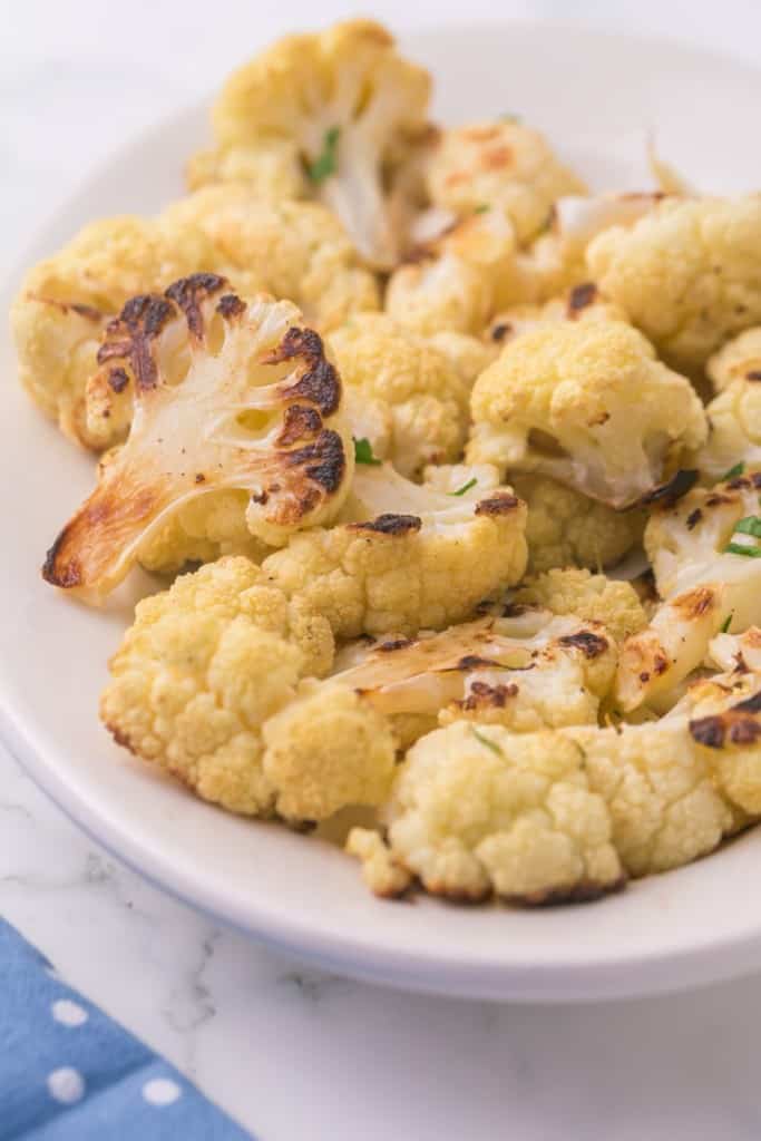 close up of a plate with seasoned roasted cauliflower