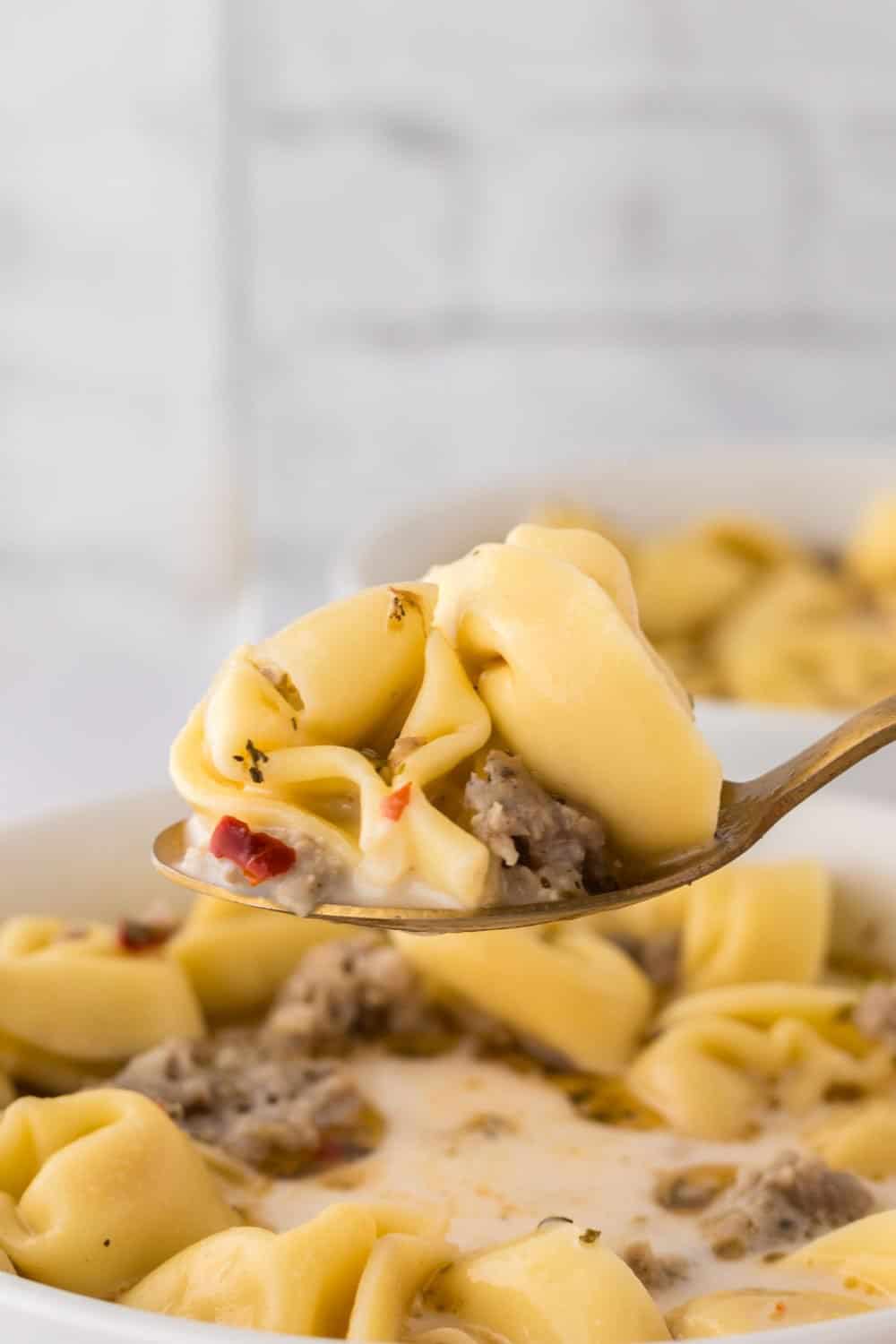 spoonful of sausage tortellini soup