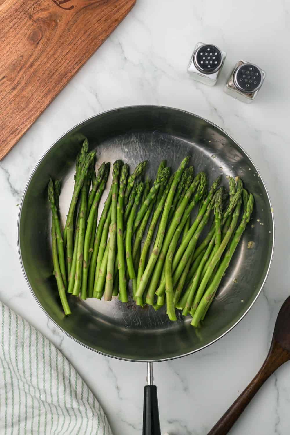 sautéed pan with olive oil minced garlic and ripe green asparagus