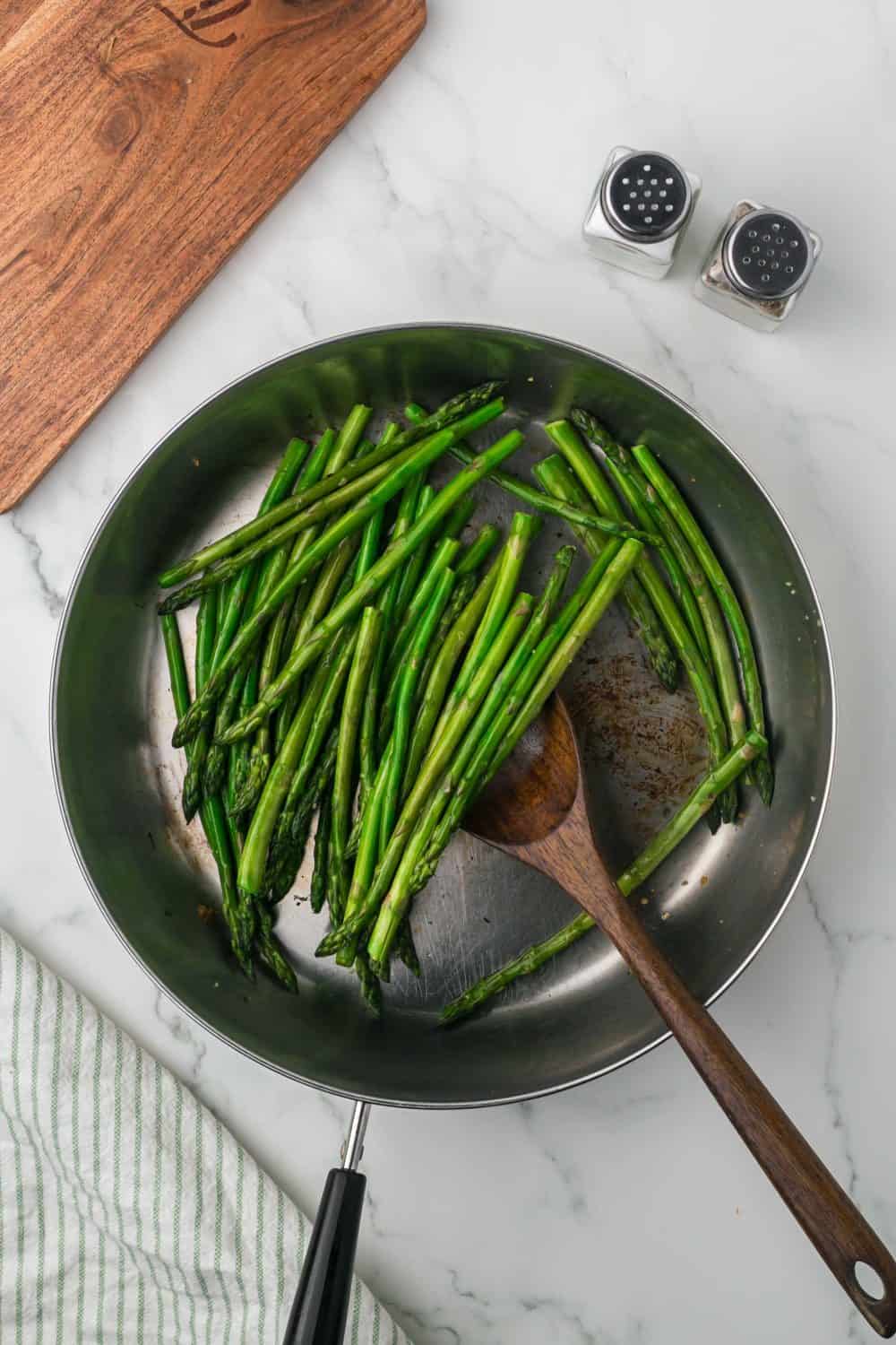 sautéed pan with olive oil minced garlic and ripe green asparagus