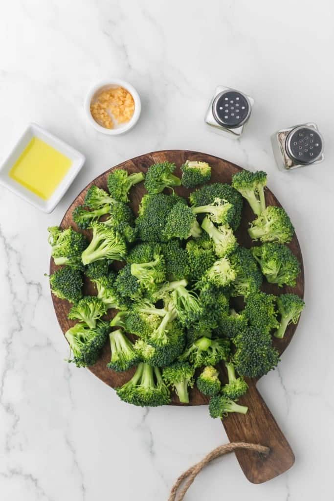 wooden cutting board with broccoli