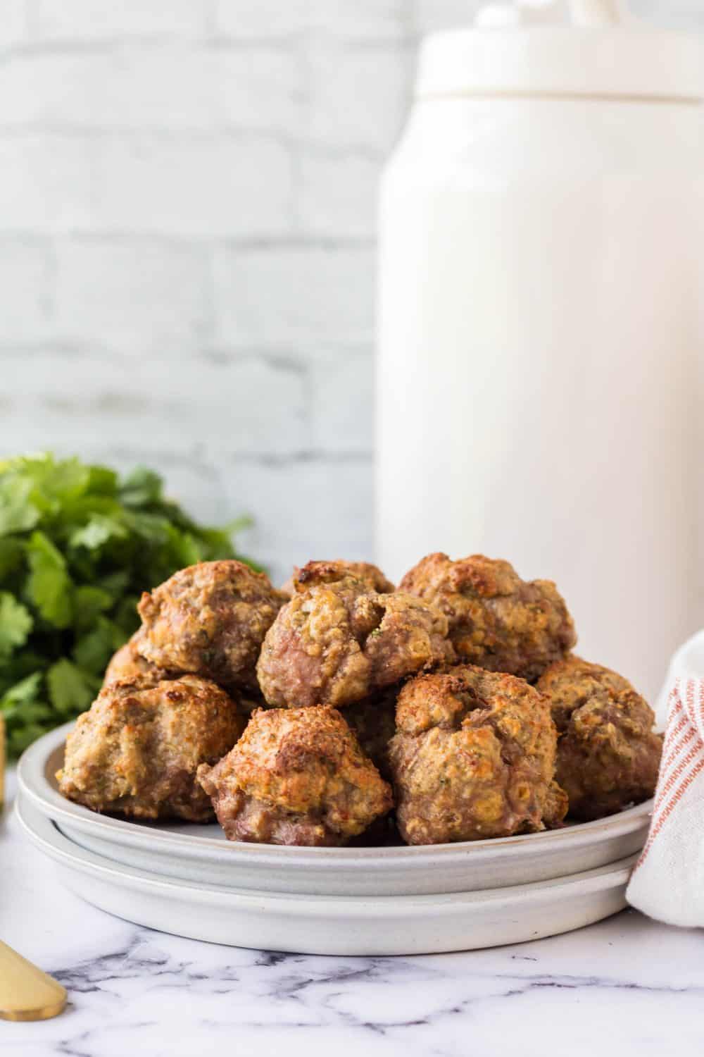 stack of turkey meatballs on a round plate