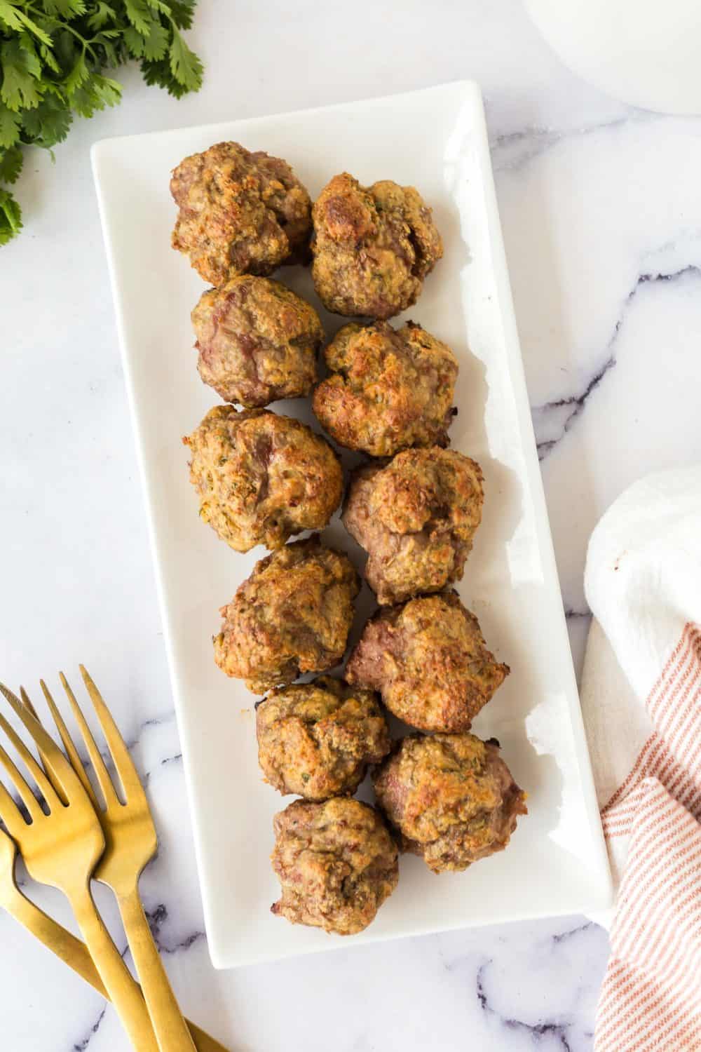 long plate with a baked stack of turkey meatballs