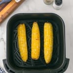 baked corn cobs in the air fryer basket