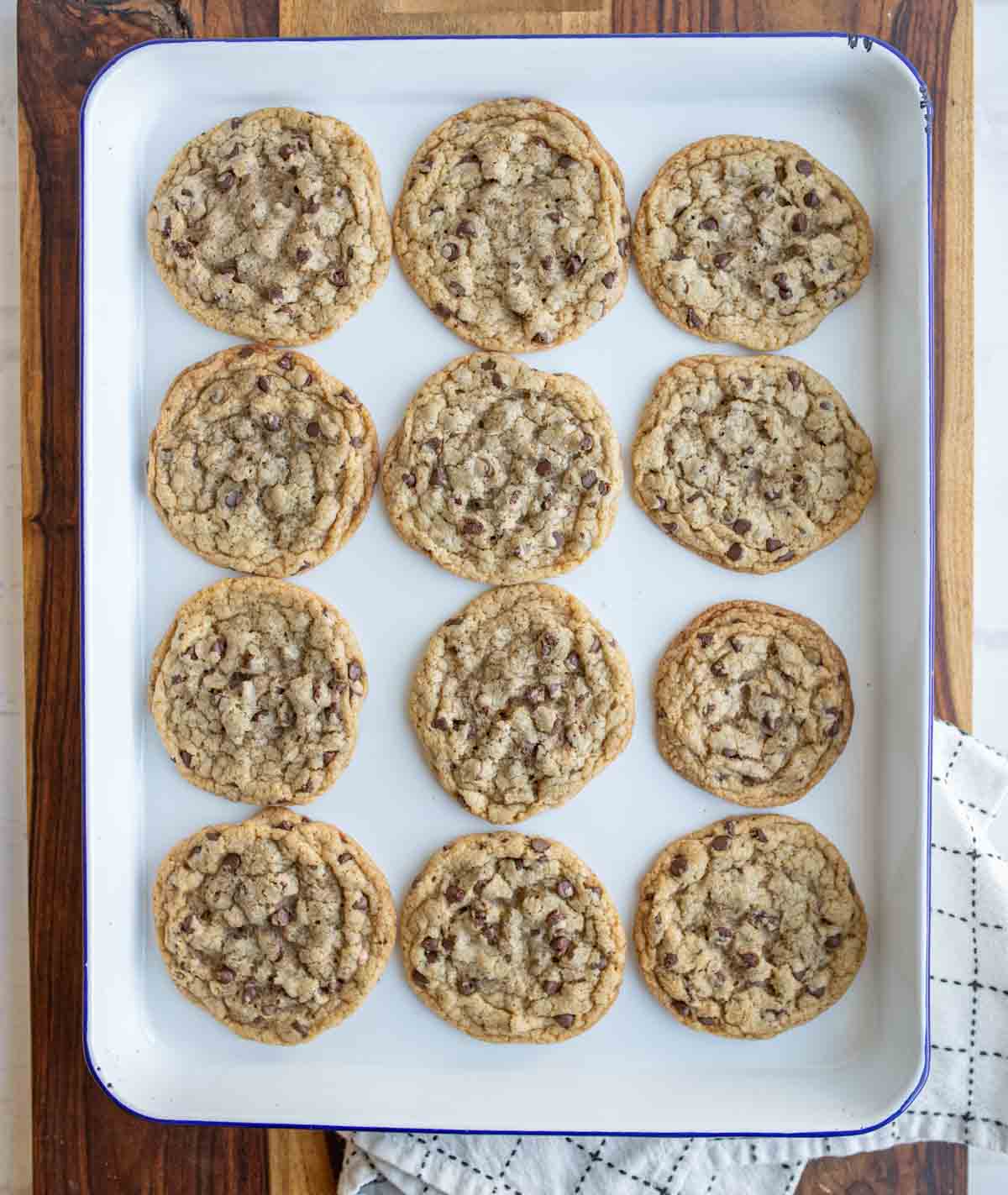 baking sheet with rows of baked brown butter chocolate chip cookies