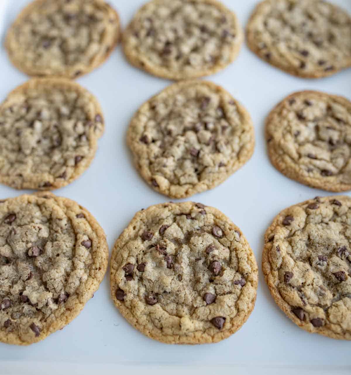 close up of brown butter chocolate chip cookies on a baking dish