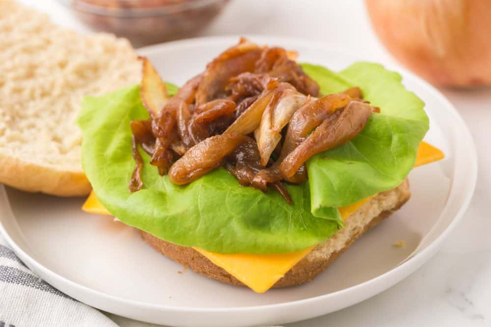 caramelized onions on lettuce on a bun