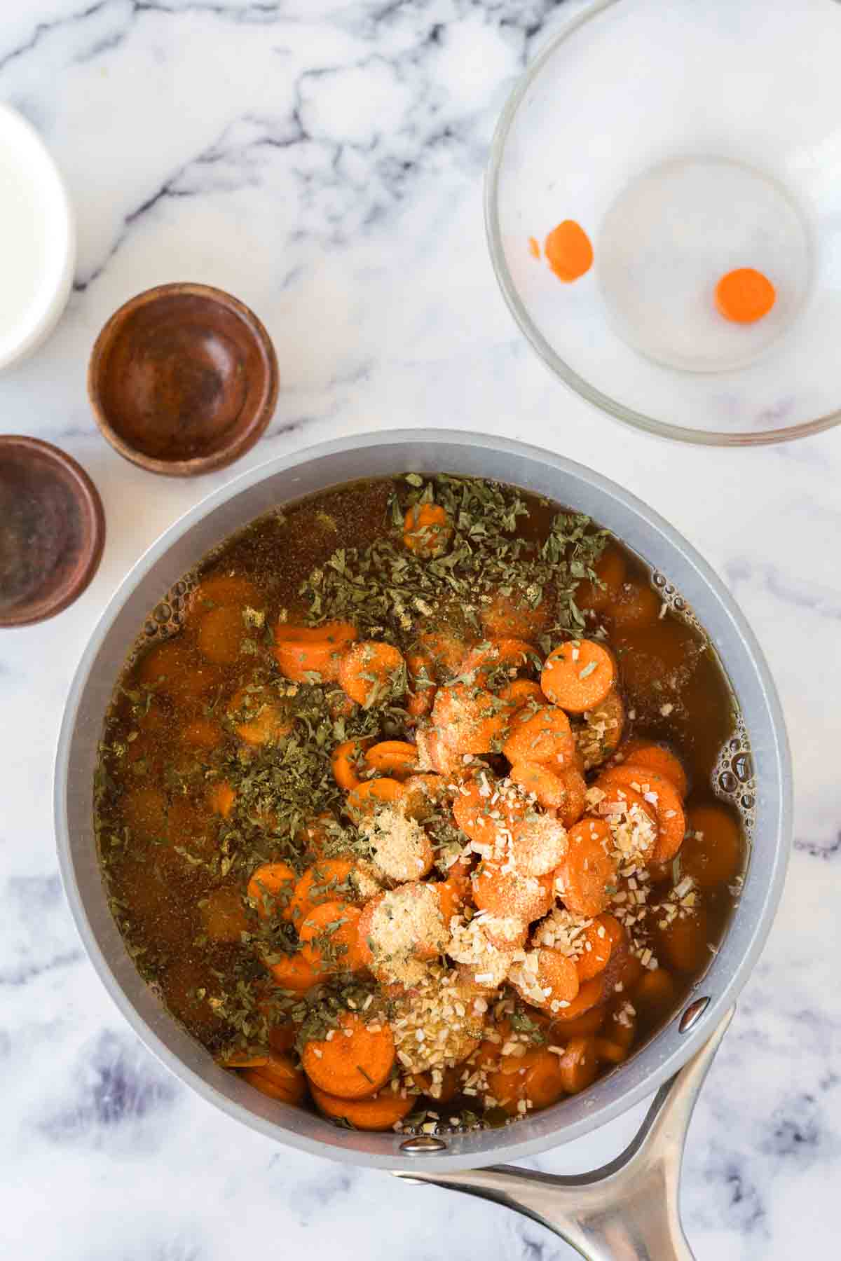 ingredients for carrot soup in a pot