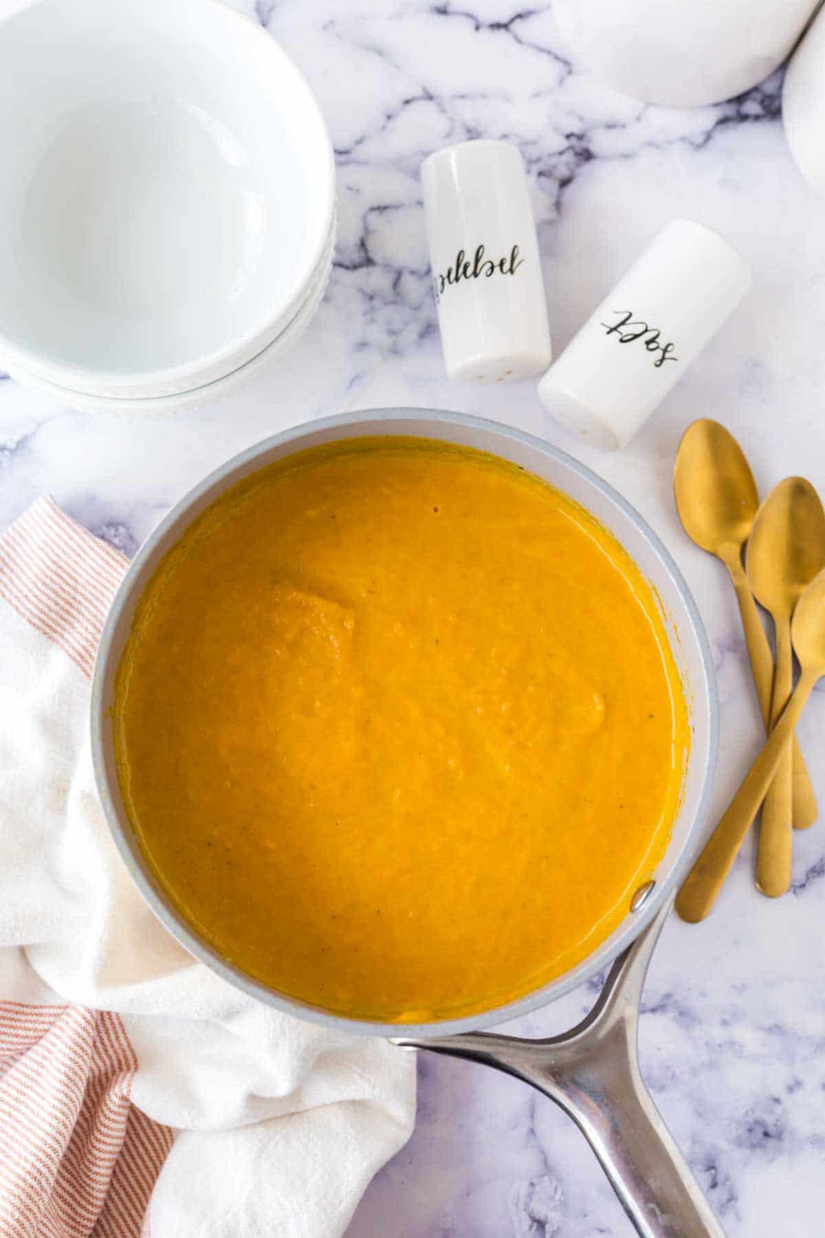 bright orange carrot soup in a pot