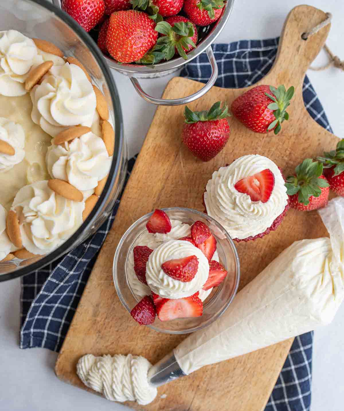 Chantilly cream in a piping bag featuring strawberries and other desserts.