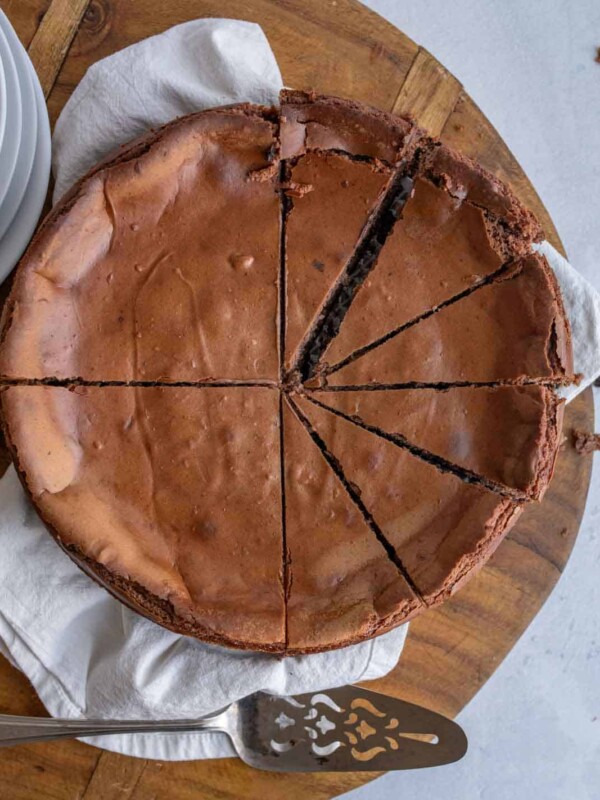 whole chocolate cheesecake sliced into perfect wedges