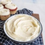 Fluffy cream cheese frosting in a bowl