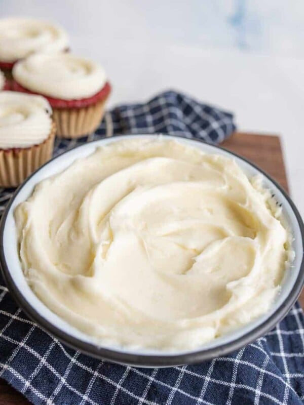 Fluffy cream cheese frosting in a bowl