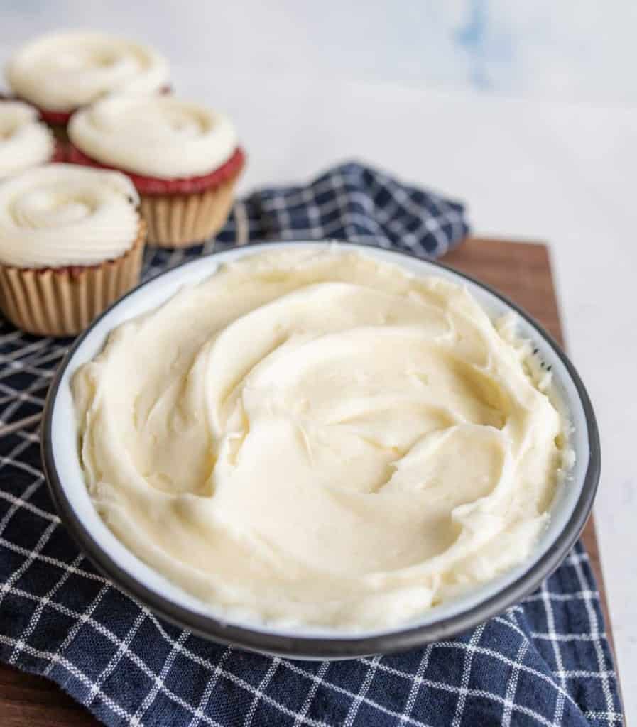 Fluffy cream cheese frosting in a bowl.
