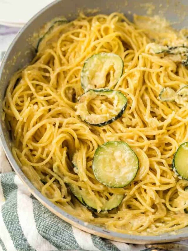 sliced zucchini in a pan with pasta
