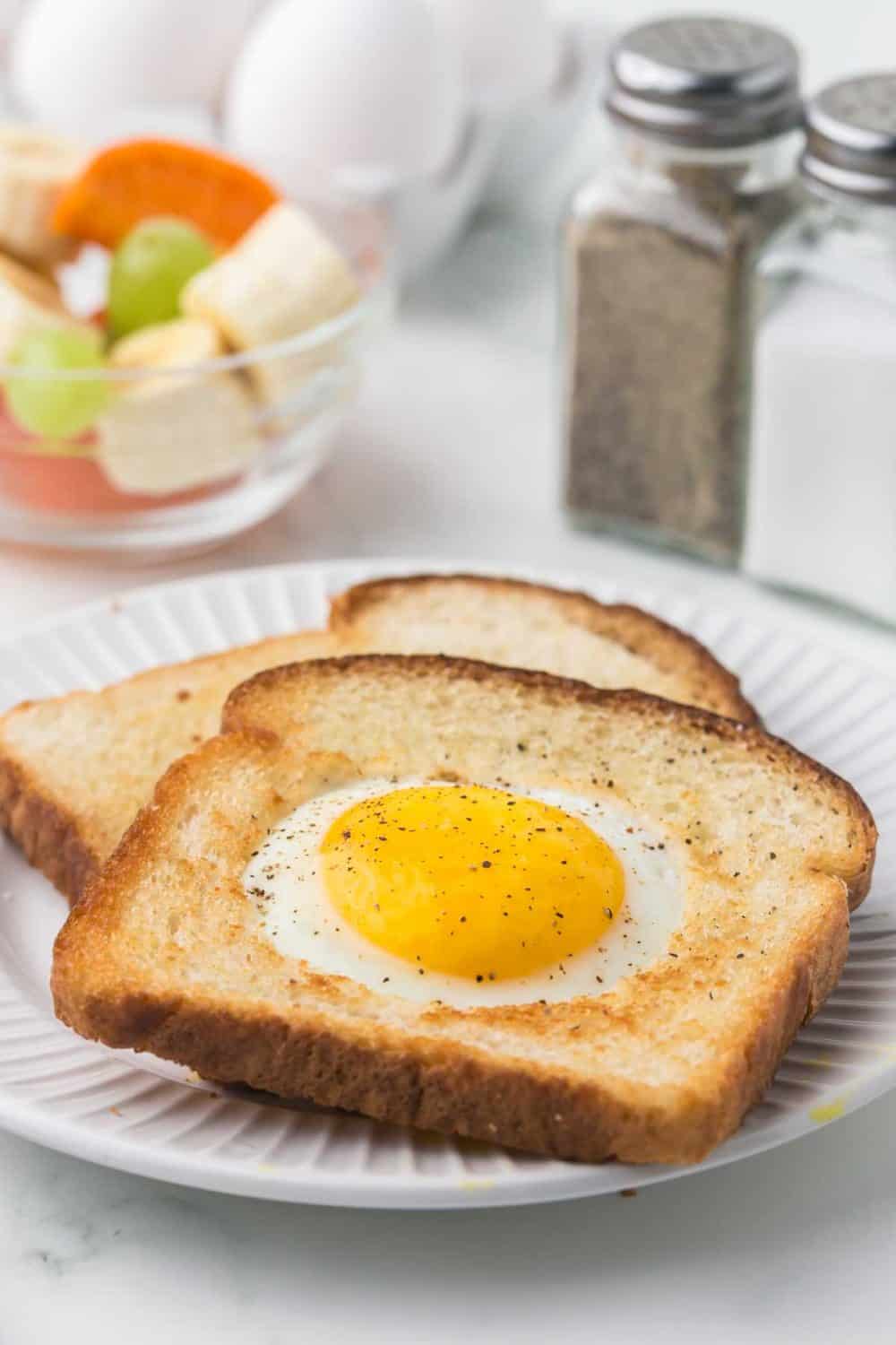 egg fried in a hole of toast on a plate