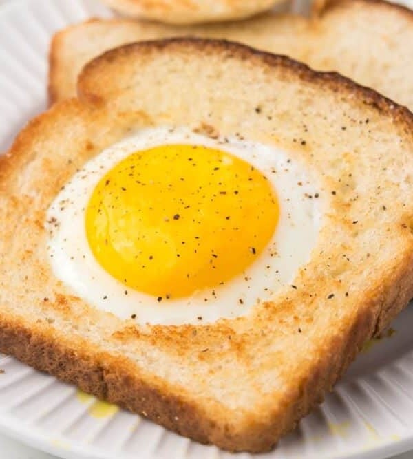 egg fried in a hole of toast on a plate