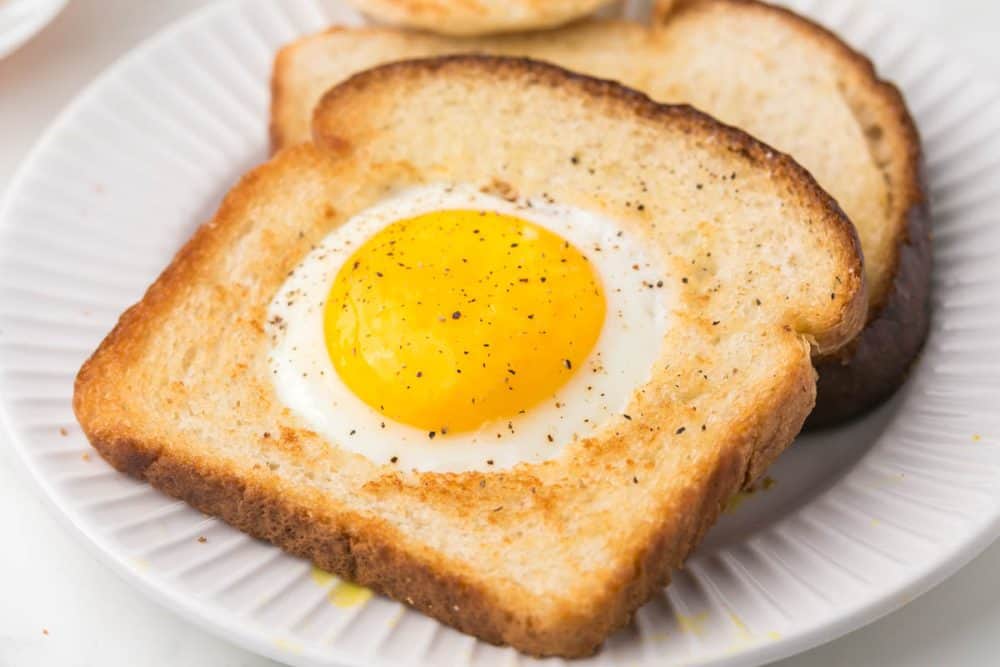egg fried in a hole of toast on a plate