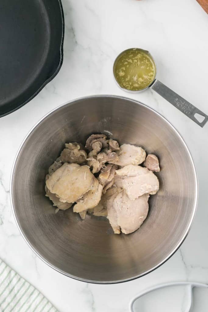 cooked chicken in a mixing bowl