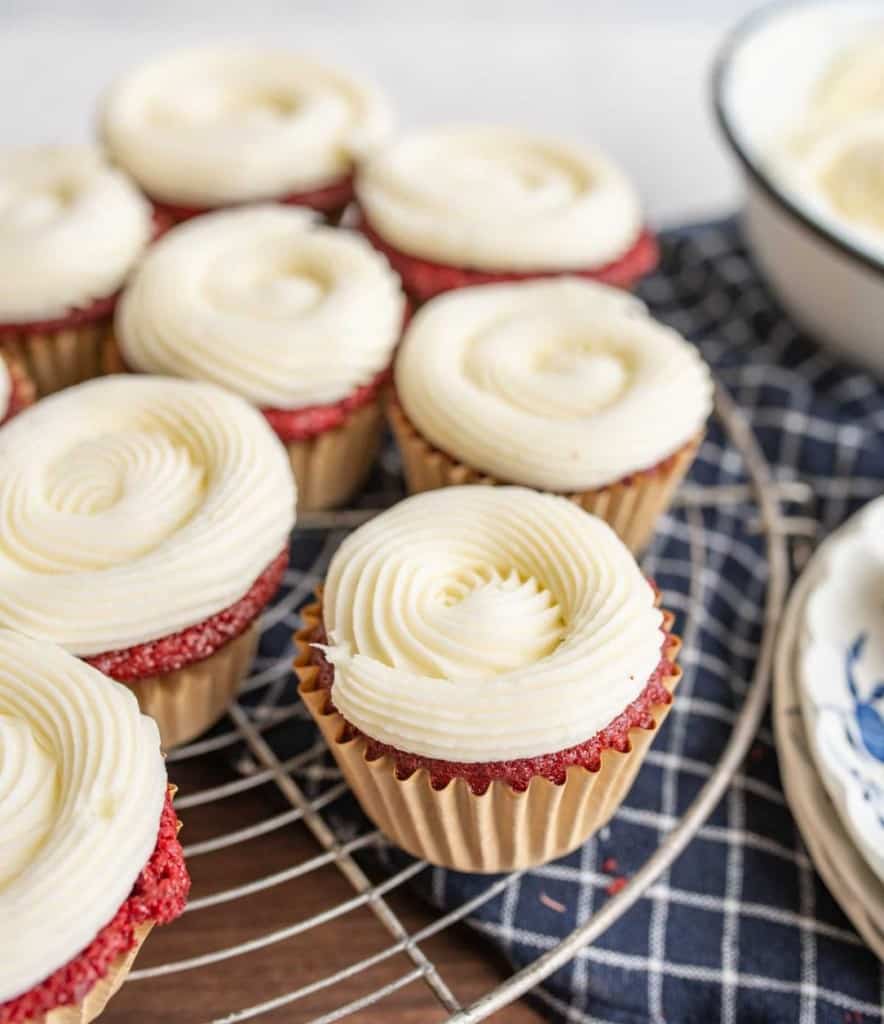 red velvet cupcakes with piped iced cream cheese frosting