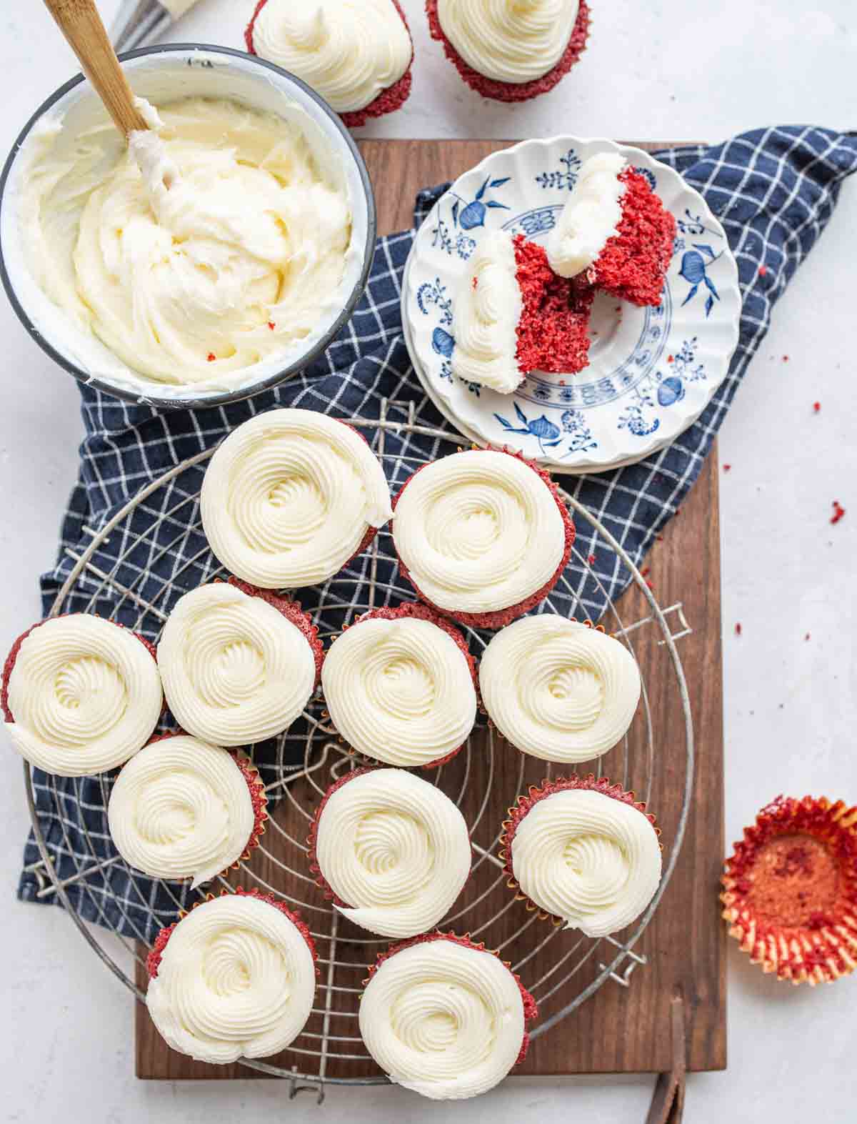 top view of an aesthetic image with cream cheese frosting and red velvet cupcakes