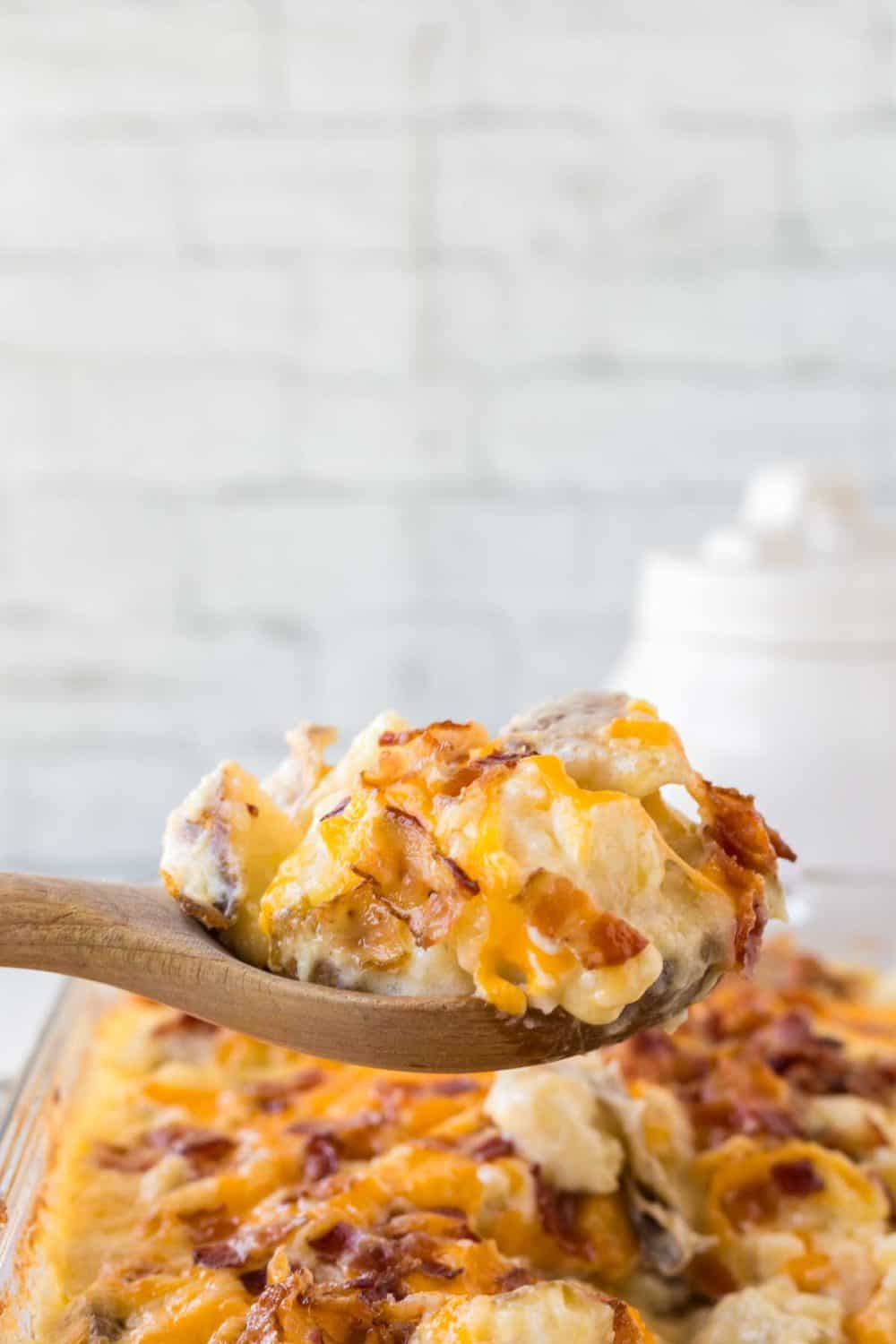 twice baked casserole and a wooden spoon scooping it out