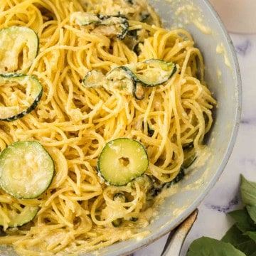 sliced zucchini in a pan with pasta