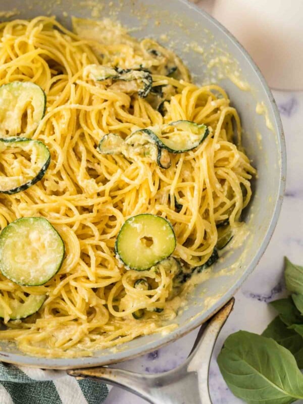 sliced zucchini in a pan with pasta