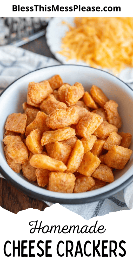 pin with text that reads homemade cheese crackers with baked cheese fish shaped crackers in a bowl