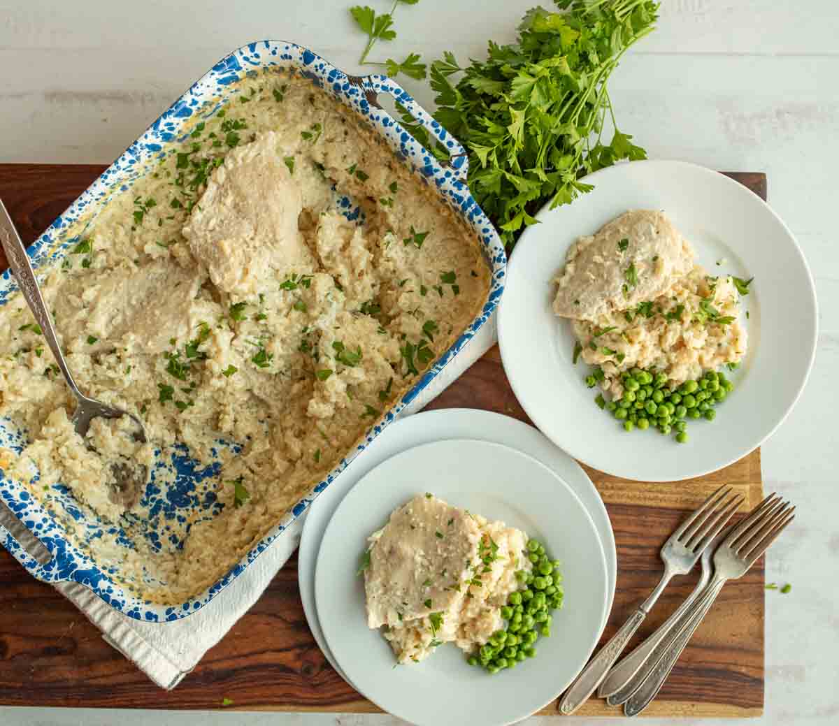 pan or finished dish with 2 servings on white plates