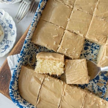 baking dish with squares of caramel cake cut out