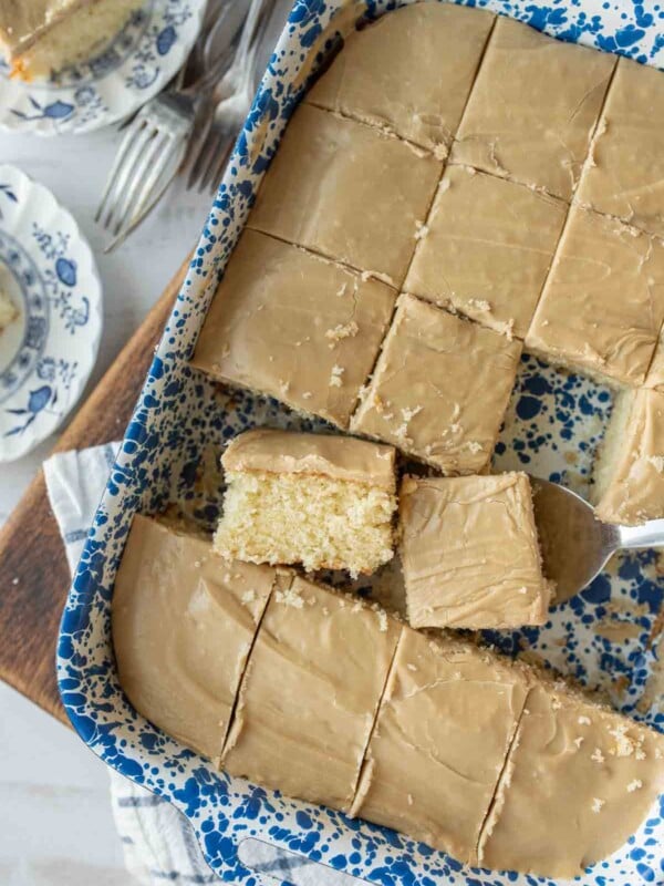 baking dish with squares of caramel cake cut out