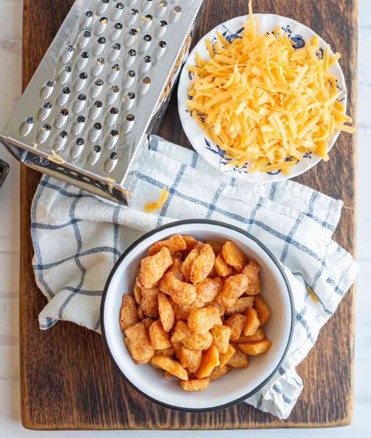 top view of baked cheese crackers in a fish shape in a bowl