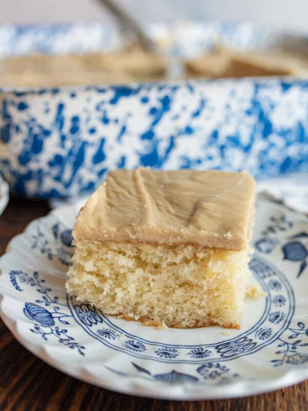 one slice of yellow cake on a plate