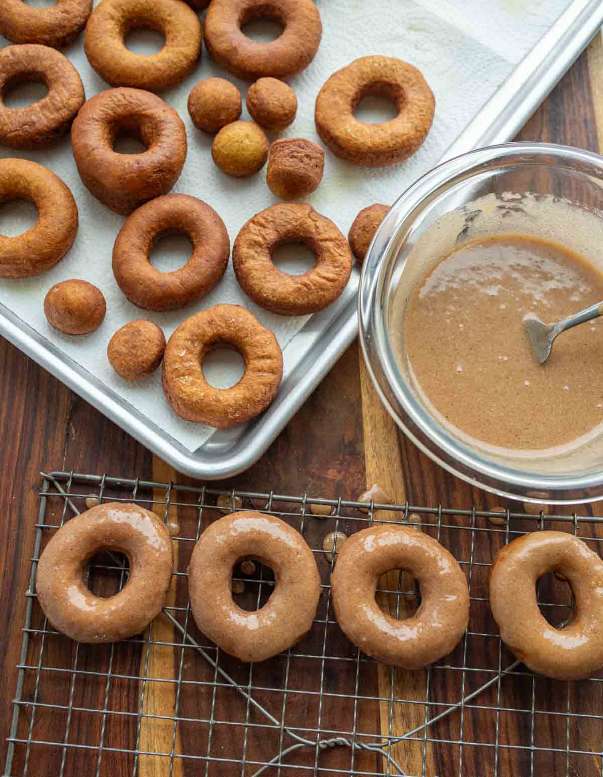 aesthetic view of pumpkin donuts before and after being glazed