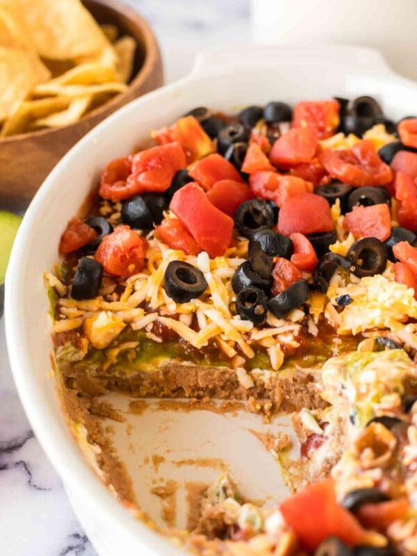 close up of a white baking casserole dish with 7 layer dip