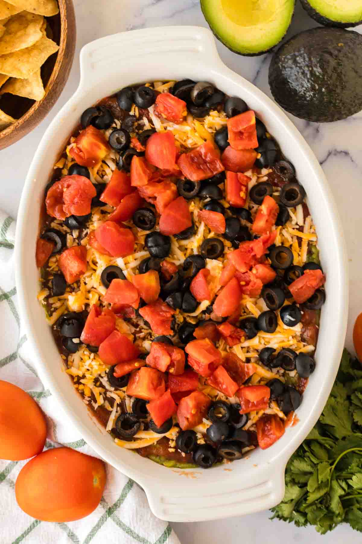 white baking casserole dish with 7 layer dip