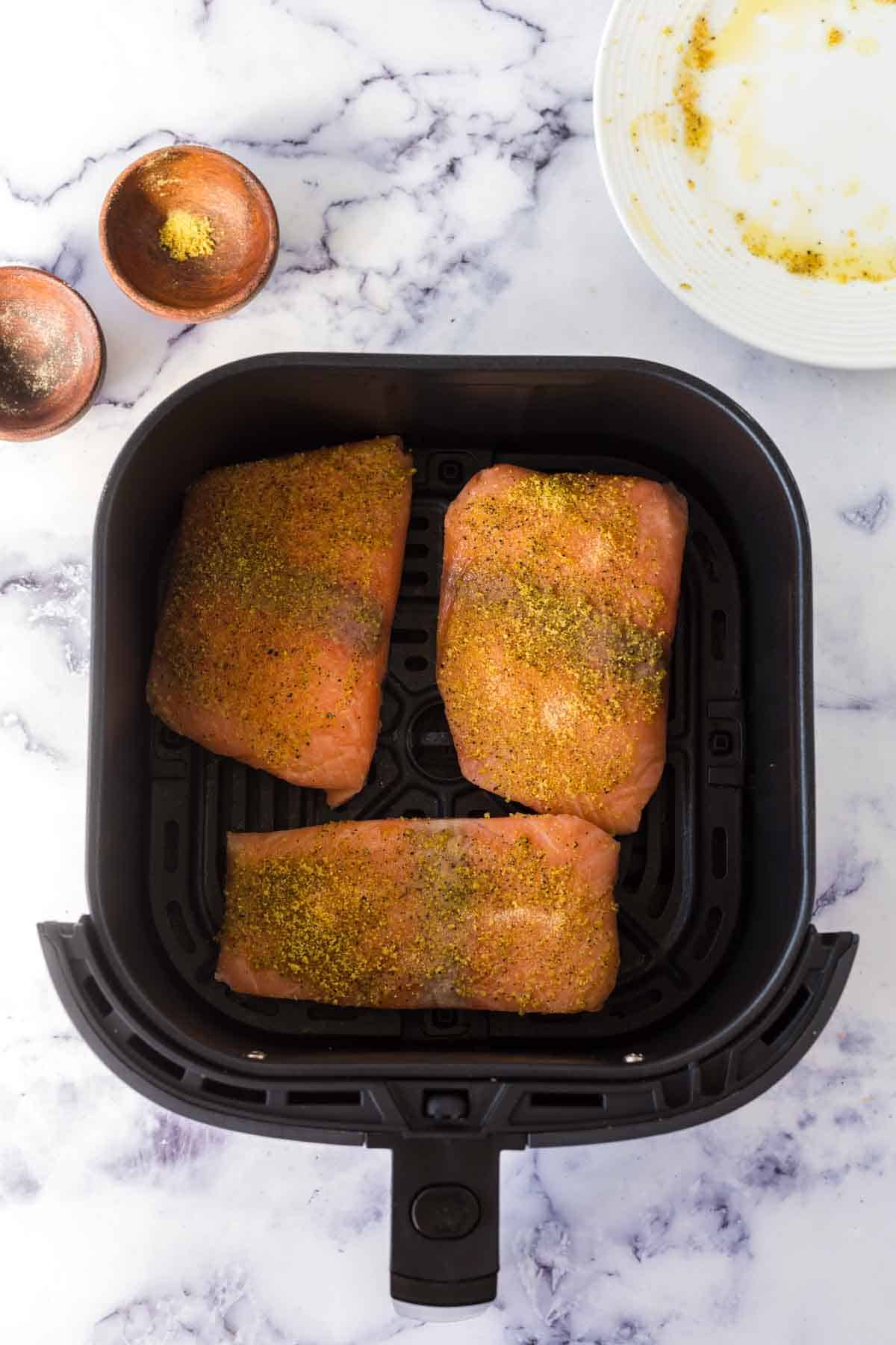 Air fryer salmon cooking.