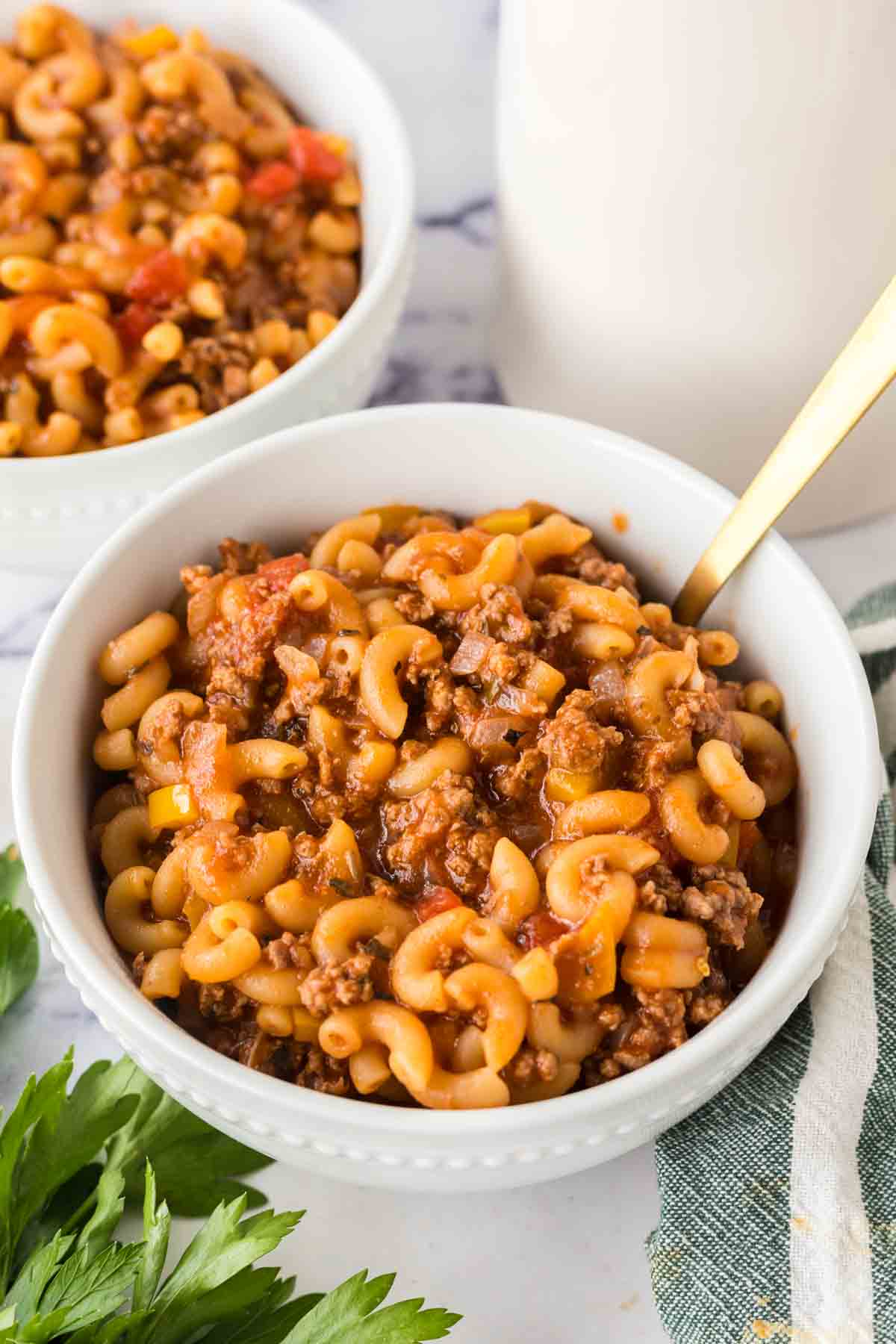 two bowls of American chop suey served and ready to eat
