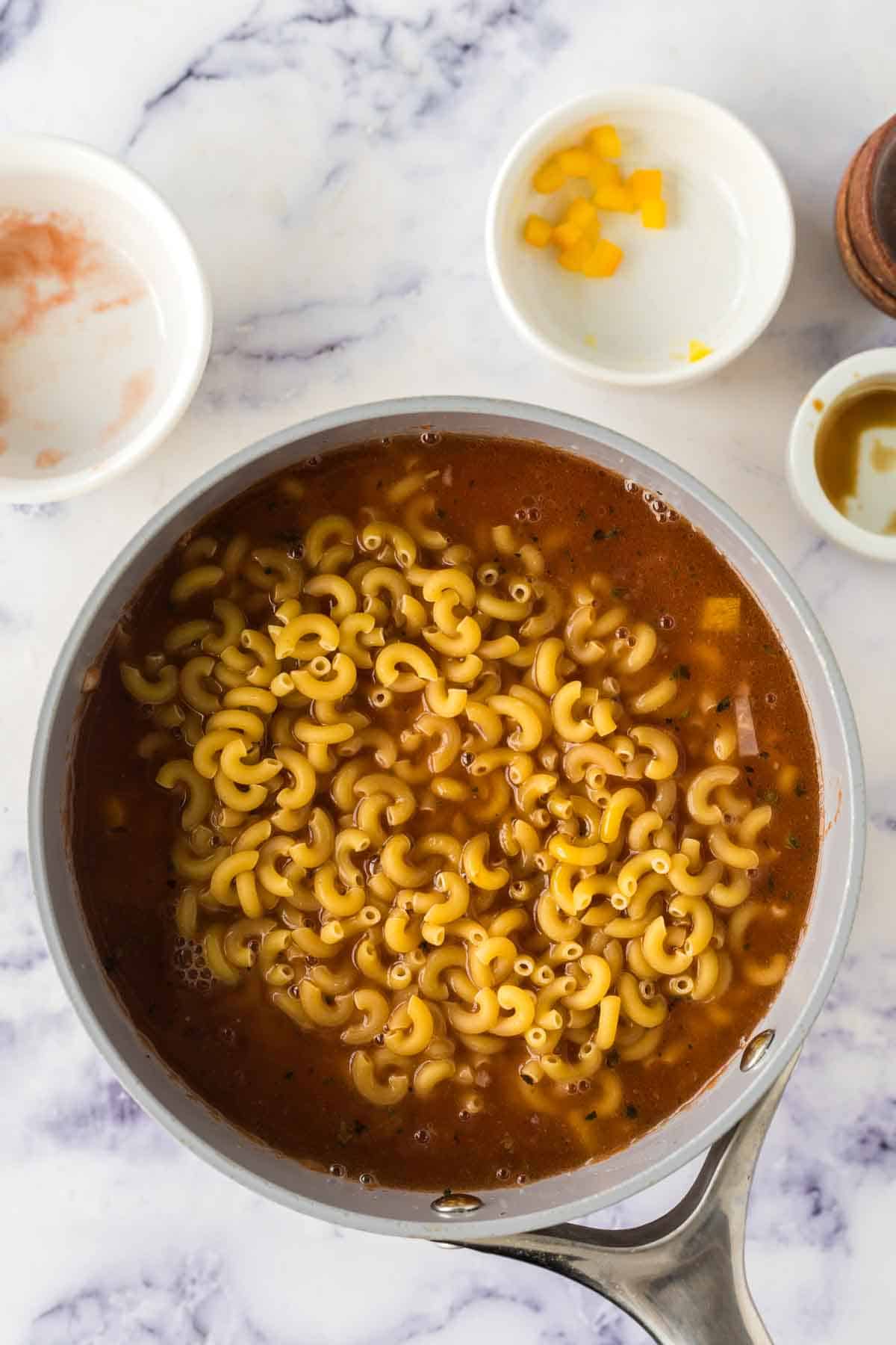 Added noodles into a large pot of chop suey.