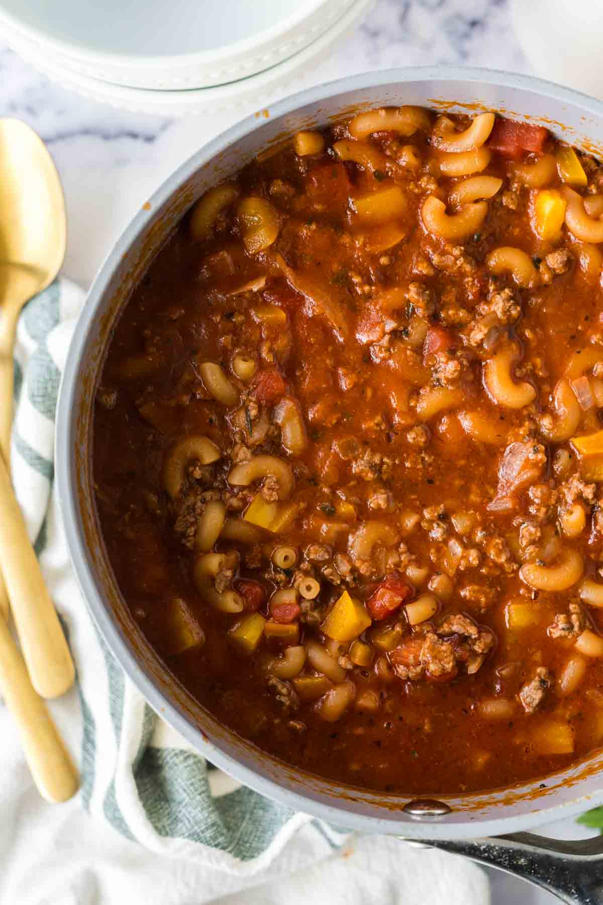 American chop suey cooking in a large pot.